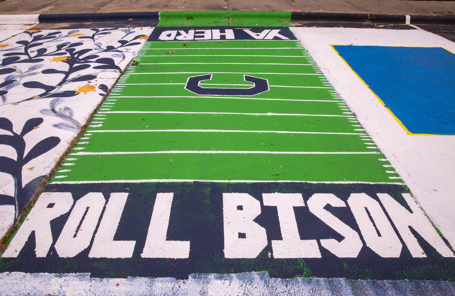 Students painting their parking spaces